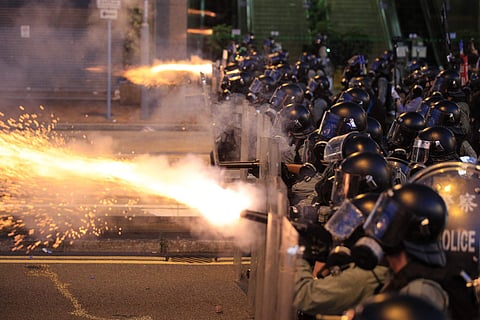 Hong Kong police fire tear gas at protesters in Sai Wan, Hong Kong. (Photo | AP)