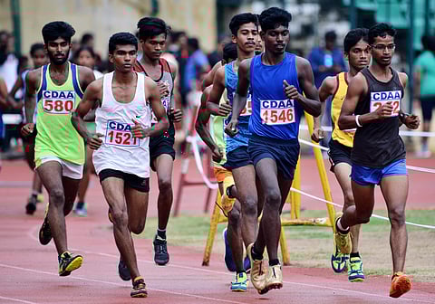 Students participating in the 5000-metre race during the 50th anniversary of Chennai Junior Athletic Championship at Nehru Stadium on 26 July 2019. (Photo | D Sampathkumar, EPS)