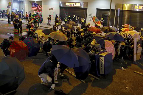 Protesters use umbrellas to shield themselves from tear gas during a protest in Hong Kong, Sunday, July 28, 2019. (Photo | AP)