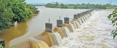 Krishna river overflows from the Khodshi dam near Karad in Maharashtra on Sunday following heavy monsoon rains | Pti