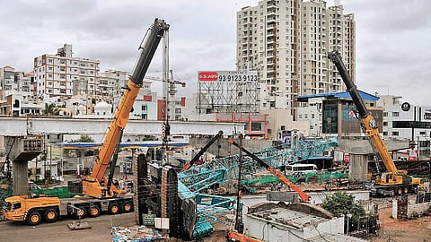Two cranes seen removing the toppled crane in Shaikpet on Tuesday morning | S Senbagapandiyan