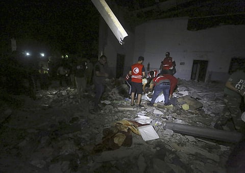 Libyan Red Crescent workers recover migrants bodies after an airstrike at a detention center in Tajoura, east of Tripoli Wednesday, July 3, 2019. An airstrike hit the detention center for migrants early Wednesday in the Libyan capital. ( Photo | AP)
