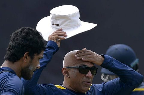 Sri Lankan cricket team coach Chandika Hathurusingha with Dinesh Chandimal (File Photo | AFP)