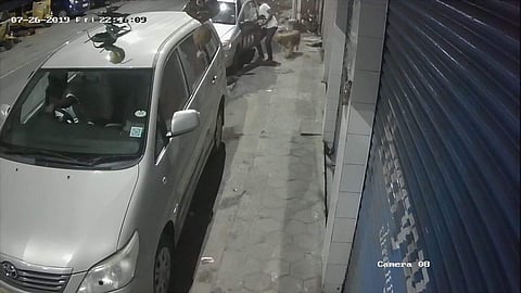 CCTV images show the man trying to coax the dog into his car in T Nagar