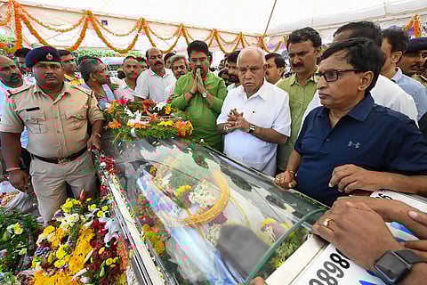 Karnataka Chief Minister B S Yediyurappa pays his last respects to the mortal remains of Cafe Coffee Day founder VG Siddhartha in Chikmagalur Wednesday July 31 2019. | PTI