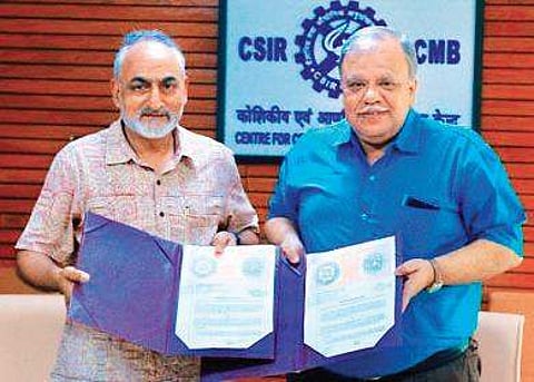 Officials display the MoU signed between CCMB and CDFD in Hyderabad on Wednesday | Express