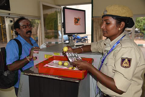 Security personnel checks for lemons at Vidhana Soudha. (Photo | Nagaraj Gadekal, EPS)