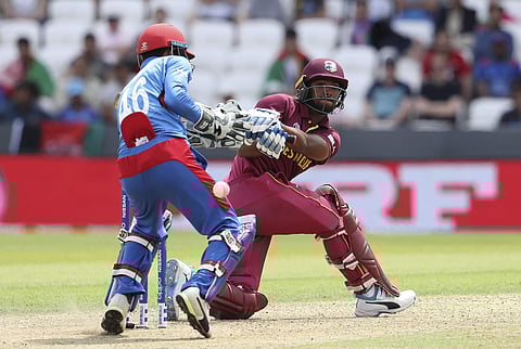 West Indies' Nicholas Pooran, right, bats during the Cricket World Cup match between Afghanistan and West Indies at Headingley in Leeds. (Photo | AP)