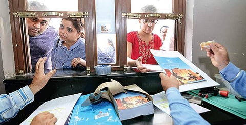 Students purchase the prospectus of a DU college for the new academic session, on Thursday. ( Photo| Naveen Kumar)