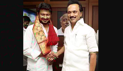 DMK President MK Stalin presents a shawl to his son Udayanidhi Stalin to mark the appointment of the latter as party youth wing Secretary at Anna Arivalayam on 5 July 2019 in Chennai. (Photo | EPS)