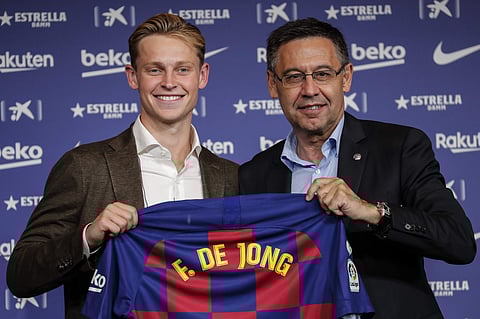 Dutch soccer player Frenkie de Jong, left, poses with FC Barcelona's President Josep Maria Bartomeu during his official presentation at the Camp Nou stadium in Barcelona. (Photo | AP)