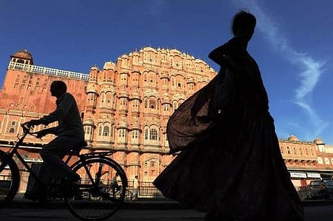 Residents of file past the Hawa Mahal, 'Palace of Winds', in the old walled city of Jaipur on November 14, 2011. | (File | AFP)