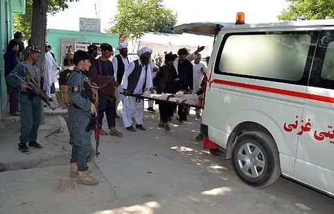 A wounded Afghan man is brought to a hospital after a car bomb attack that targeted an intelligence unit in Ghazni on July 7, 2019. (Photo | AFP)