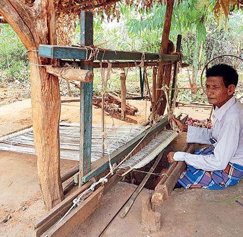 Ram Hial weaving a base cloth in Jhigidi village of Rayagada district. (Photo | EPS)