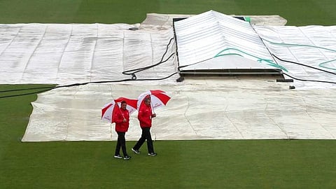 Umpires Richard Illingworth, right, and Richard Kettleborough inspect the field of play as it continues to rain at the ICC Cricket World Cup group stage match at the County Ground in Bristol. (File Photo | AP)