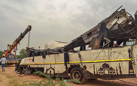 The mangled remains of a bus are seen after it skidded off the six-lane Yamuna Expressway and fell into a large drain near Agra on 8 July 2019. (Photo | PTI)