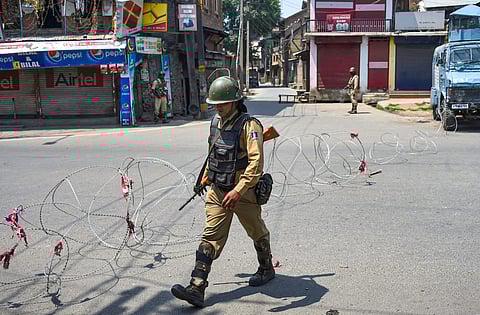 CRPF personnel stand guard during a strike called by separatist leaders on the third death anniversary of Hizbul Mujahideen militant commander Burhan Wani in Srinagar on 8 July 2019. (Photo | PTI)