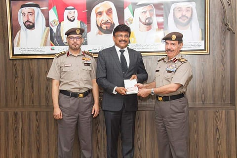 Kingston Holdings FZC chairman, Lalu Samuel with UAE police officials. (Photo | Lalu Samuel, Facebook)