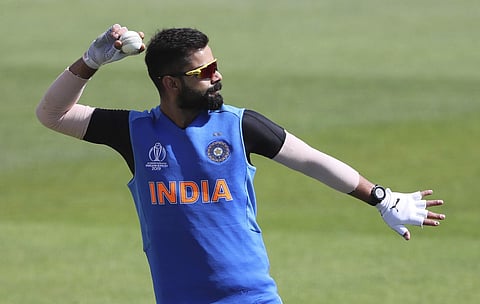 India skipper Virat Kohli throws the cricket ball during training. (Photo | AP)