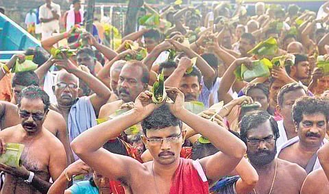 Devotees offer bali at the beach on Wednesday Vincent Pulickal