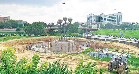 Work is going on around steel sprouts where the fountain will come up.