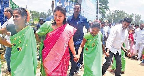 Deputy CM Pushpa Srivani performing Dhimsa dance with tribal folk artistes on World Adivasi Day celebrations at Araku in the district on Friday | EXPRESS