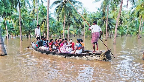 People of marooned villages in Konaseema of East Godavari district travelling in a boat on Saturday I Express