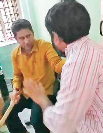 Video grab of Karwan MLA Kausar Mohiuddin thrashing a man (Photo | Screengrab)