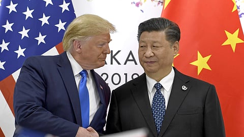 US President Donald Trump, left, shakes hands with Chinese President Xi Jinping during a meeting on the sidelines of the 2019 G-20 summit in Osaka, western Japan.