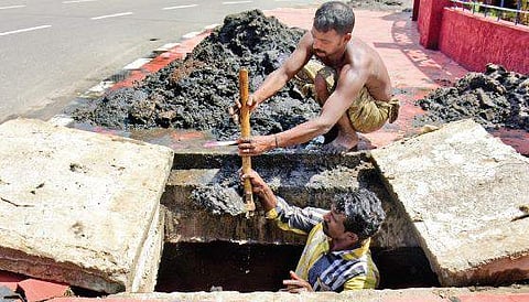 Workers cleaning a sewer at Thampanoor. Cases of suspected leptospirosis are more common among those who engage in scavenging, cleaning and agriculture activities B P Deepu
