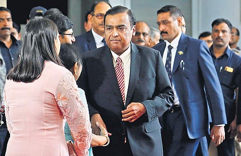 Chairman of Reliance Industries Limited Mukesh Ambani (C) arrives for the company’s 42nd AGM in Mumbai on Monday | AP