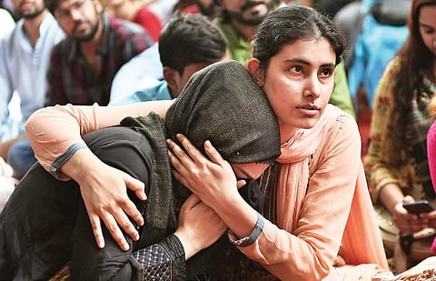 A Kashmiri woman breaks down after listening to a fellow Kashmiri narrating memories of past Eid in the Valley. Kashmiris living in Delhi gathered at Jantar Mantar on Monday to observe Eid al-Adha. (Photo | Parveen Negi)
