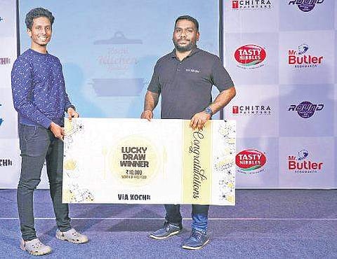 Via Kochi Founder Jayakrishnan G Pillai presents the cash award to online contest winner Ashish Lal