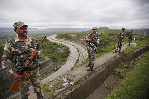 CRPF personnel stand guard on Jammu-Srinagar national highway on the eve of 73rd Independence Day celebrations in Jammu Wednesday August 14 2019. | PTI