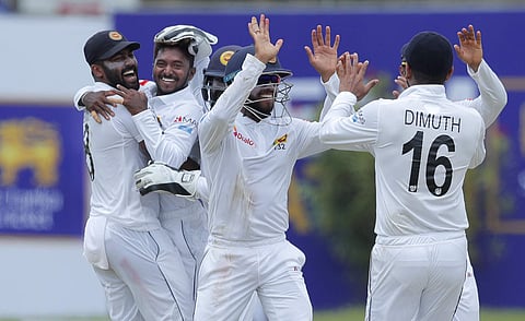 Sri Lanka's Akila Dananjaya (second left) celebrates taking the wicket of New Zealand's Kane Williamson with is team mates during the day one of the first Test in Galle (Photo | AP)