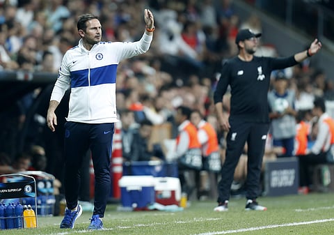 Chelsea's head coach Frank Lampard , left, and Liverpool's manager Jurgen Klopp gesture during the UEFA Super Cup soccer match between Liverpool and Chelsea, in Besiktas Park, in Istanbul. (Photo | AP)