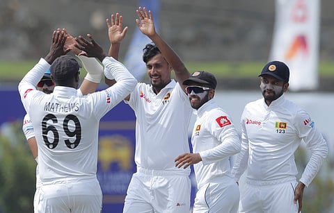 Sri Lanka's Suranga Lakmal, center, celebrates the dismissal of New Zealand's Ross Taylor with his teammates during the day two of the first test cricket match between Sri Lanka and New Zealand in Galle. (Photo | AP)