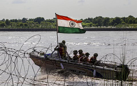 BSF soldiers on a boat patrol the Chenab river on the eve of Independence Day along the India Pakistan border in Akhnoor about 55 km from Jammu (Photo | PTI)