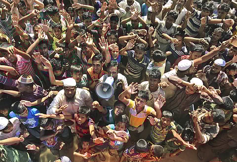 Rohingya refugees shout slogans against repatriation at Unchiprang camp near Cox's Bazar, in Bangladesh. (Photo | AP)