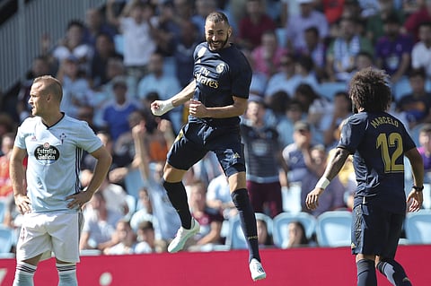 Real Madrid's Karim Benzema, centre, celebrates after scoring the opening goal. (Photo | AP)