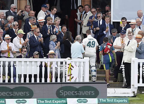 Australia's Steve Smith leaves the pitch injured after being hit by a ball bowled by England's Jofra Archer during play on day four of the 2nd Ashes Test cricket match between England and Australia at Lord's cricket ground in London. (Photo | AP)