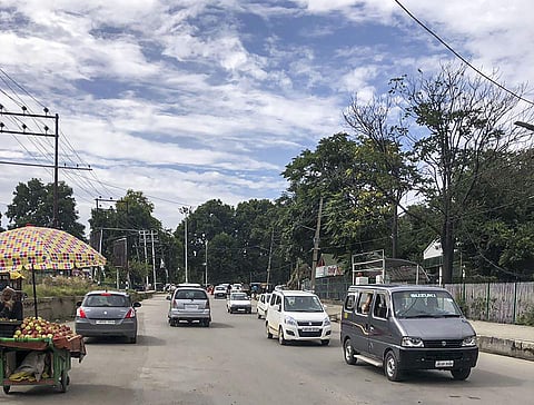 Private vehicles ply on a road after authorities eased restrictions in some parts of Srinagar on Saturday, August 17. (Photo | PTI)