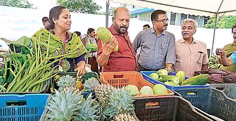 Agriculture Minister V S Sunilkumar at the fair organised by the Association of Agriculture Officers to help farmers at Kochi Marine Drive on Sunday | Express