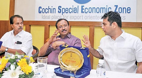 Union Minister of State(MoS) for External Affairs and Parliamentary Affairs V Muraleedharan sharing a light moment with Hibi Eden, MP, as P T Thomas, MLA, looks on at the interaction with exporters at Cochin Special Economic Zone, Kochi, on Sunday | A Sa
