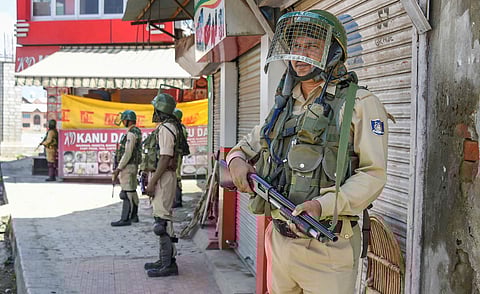 Security personnel stand guard at a check point during restrictions after Centre abrogated Article 370 and divided Jammu and Kashmir into two union territories in Srinagar Sunday August 18 2019. | PTI