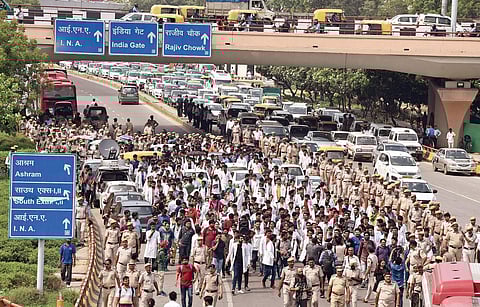 Members of Resident Doctors Association (RDA) of Safdarjung Hospital and AIIMS protest on Aurobindo Marg Road; (Left) Patients wait outside the OPD at AIIMS | parveen negi & Arun Kumar
