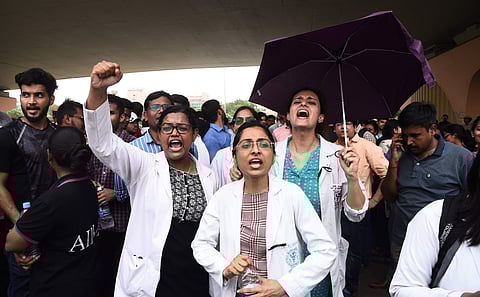 Doctors and medical students shout slogans during a protest against the National Medical Commission (NMC) Bill outside All India Medical Science in New Delhi on Thursday August 1 2019. | (Parveen Negi | EPS)