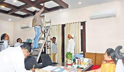 Repair works under way at the Kanaka Durga temple EO’s chamber after a part of the roof collapses due to heavy rains in Vijayawada on Thursday | Express