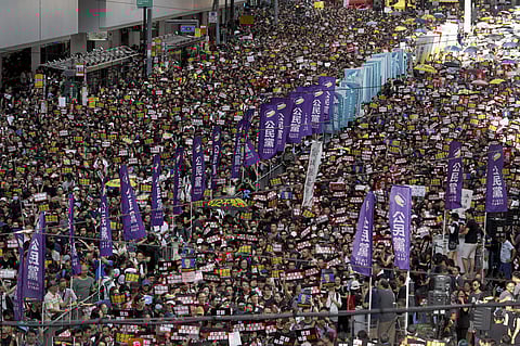 Thousands of Hong Kong protesters marched from a public park to call for an independent investigation into police tactics. (Photo | AP)