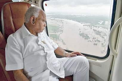 Chief Minister B S Yediyurappa conducting aerial survey in the flood hit areas (File Photo)